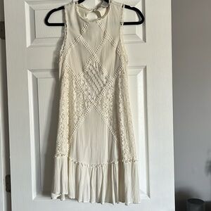 Knee length summer dress. Lacy on front.